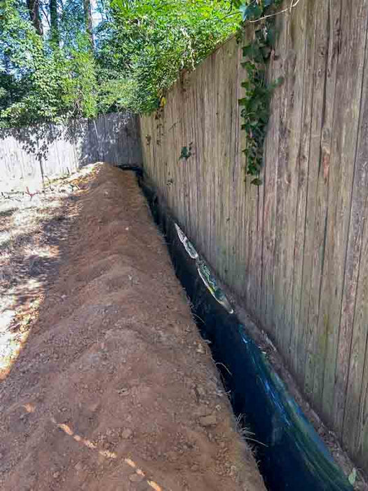 Under Fence Water Barrier