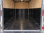 Black HDPE trailer liner as a wainscot panel over plywood walls inside an enclosed cargo trailer
