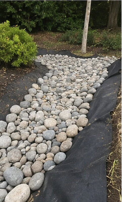 Filter fabric under a residential dry creek bed
