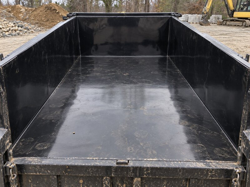 HDPE dump trailer liner installed in a solid-side dump trailer at a construction site
