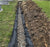 French drain fabric in a long lawn French drain
