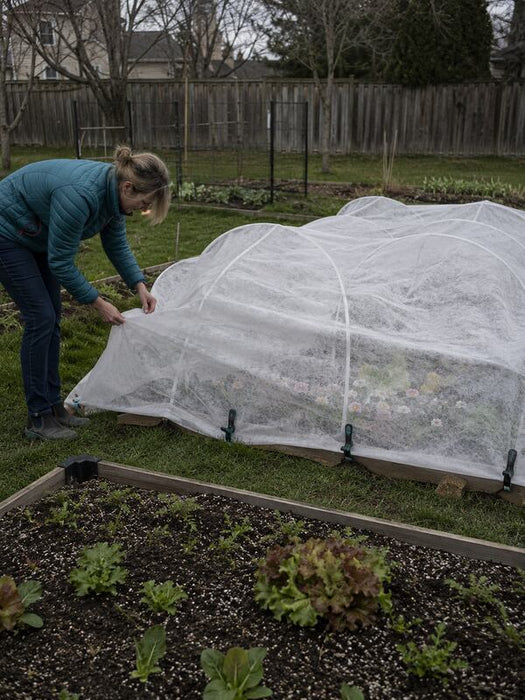 Frost cloth row cover over a garden
