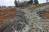 Geotextile fabric under a rock-lined drainage channel
