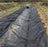 Non-woven geotextile filter fabric in a culvert swale
