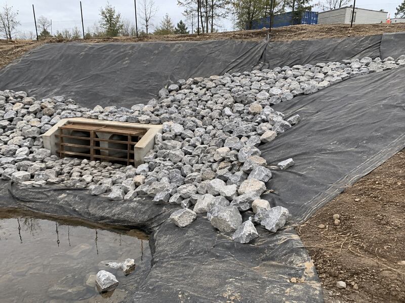 Geotextile-lined riprap at a drainage site
