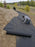Landscape weed barrier fabric installed on a hillside
