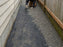 Landscape fabric installed along a narrow side yard
