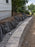 Non-woven geotextile fabric wrapping drainage gravel behind a segmental retaining wall
