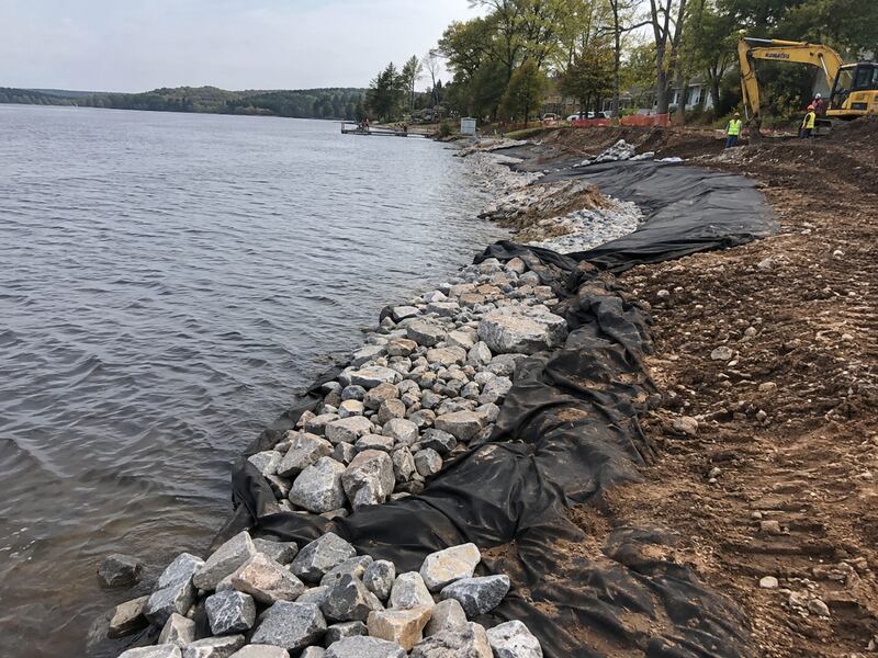 Non-woven geotextile fabric placed beneath riprap stone for shoreline erosion control
