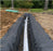 Non-woven geotextile fabric wrapping a residential French drain

