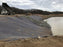 Riprap over geotextile fabric on a reservoir embankment
