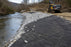 Riprap fabric for riverside bank stabilization
