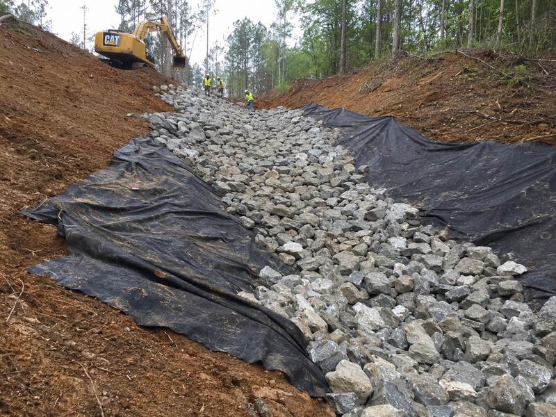 Riprap over geotextile fabric in a steep drainage channel
