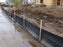 Silt fence on wood stakes along a construction site perimeter
