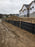 Silt fence for erosion control at a construction site
