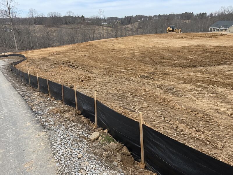 Silt fence fabric on wood stakes
