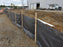 Silt fence at a muddy construction site
