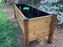 Raised planter filled with dirt and lined with HDPE plastic