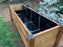 Planter liner installed in a cedar raised planter