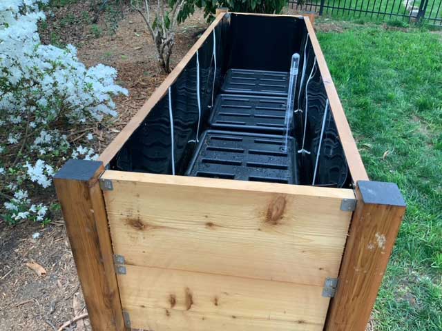 Waterproof plastic installed in a raised planter